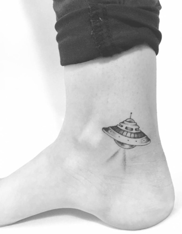 Tiny spaceship on ankle tattoo design