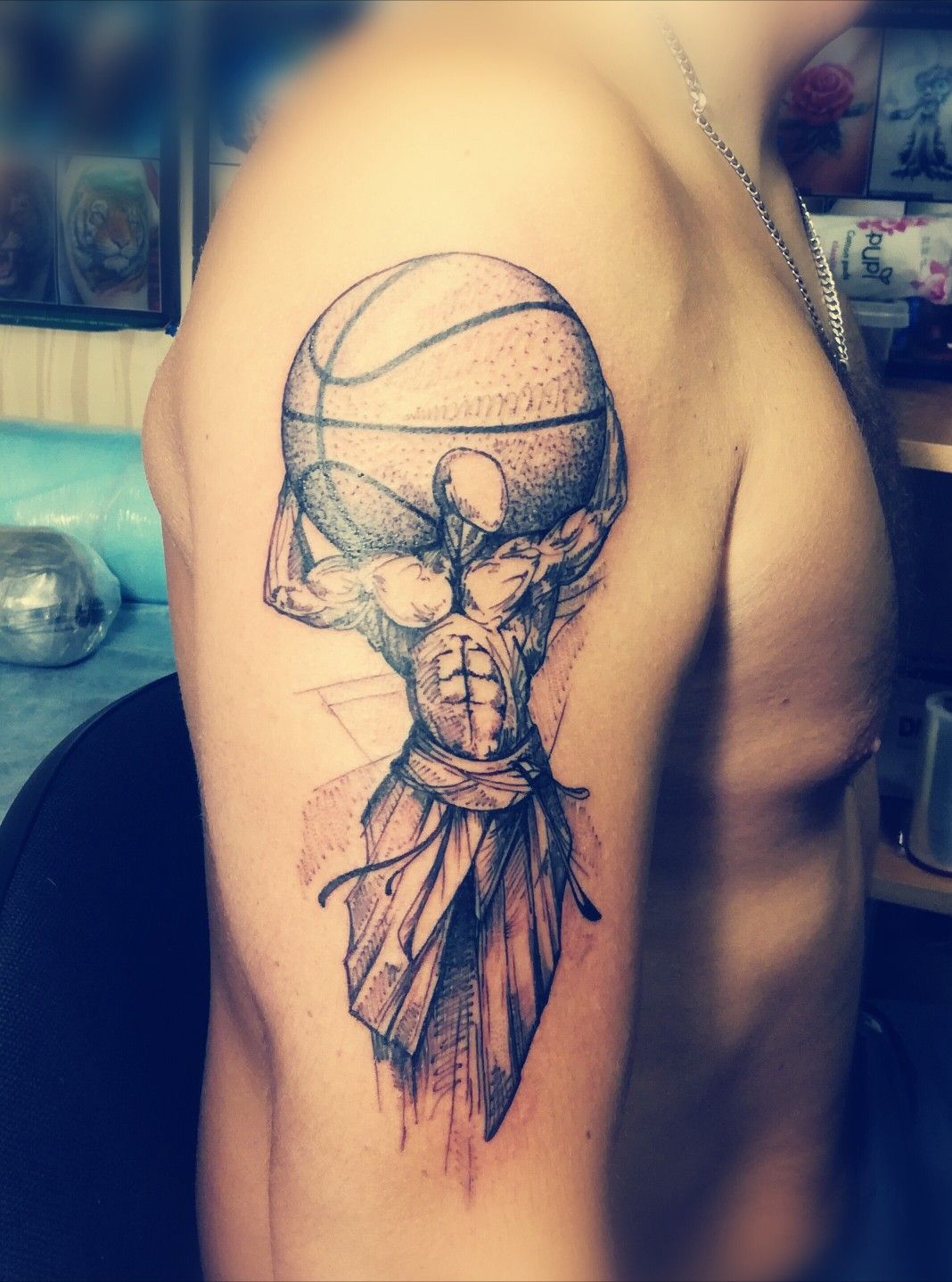 Strong man carrying basketball tattoo - Tattoo Designs for Women